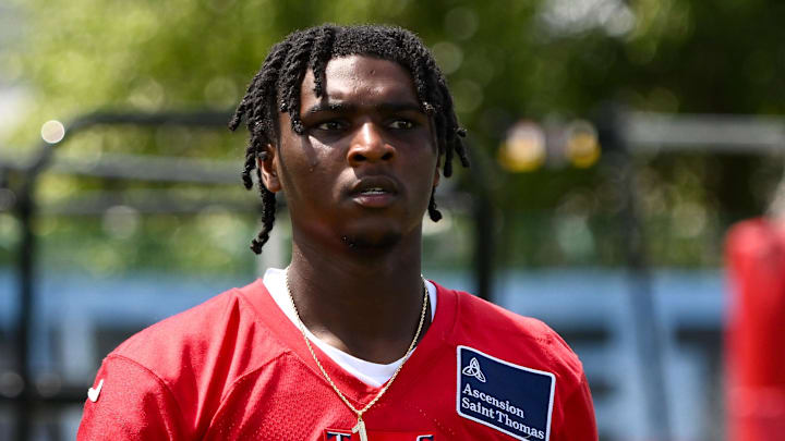 Tennessee Titans quarterback Cameron Ward (1) walks off the field during training camp.