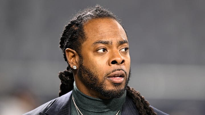 Richard Sherman looks at the sidelines
