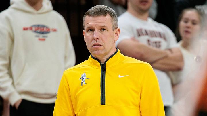 Feb 24, 2026; Stillwater, Oklahoma, USA; West Virginia Mountaineers coach Ross Hodge watches game play during the first half against the Oklahoma State Cowboys at Gallagher-Iba Arena. Mandatory Credit: William Purnell-Imagn Images Feb 24, 2026; Stillwater, Oklahoma, USA; West Virginia Mountaineers coach Ross Hodge watches game play during the first half against the Oklahoma State Cowboys at Gallagher-Iba Arena. Mandatory Credit: William Purnell-Imagn Images