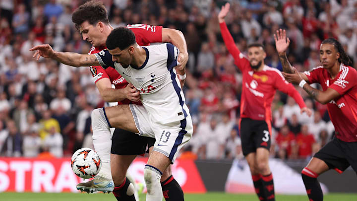 Harry Maguire (left) and Dominic Solanke challenge for the ball in the Europa League final.