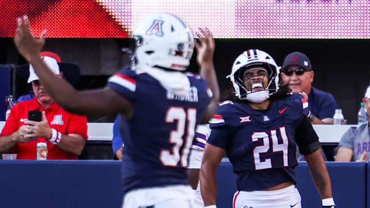 Nov 8, 2025; Tucson, Arizona, USA; Arizona Wildcats running back Quincy Craig (24) celebrates a touchdown me made during the fourth quarter of the game against the Kansas Jayhawks at Arizona Stadium. Mandatory Credit: Aryanna Frank-Imagn Images