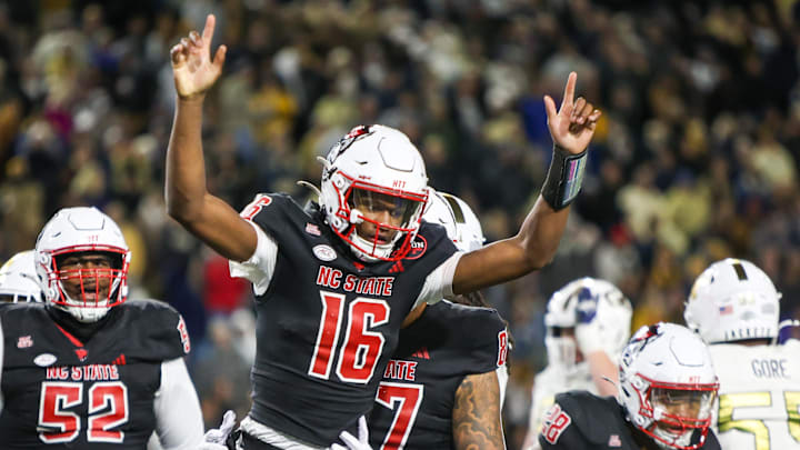 Nov 21, 2024; Atlanta, Georgia, USA; North Carolina State Wolfpack quarterback CJ Bailey (16) celebrates after a touchdown against the Georgia Tech Yellow Jackets in the fourth quarter at Bobby Dodd Stadium at Hyundai Field. Mandatory Credit: Brett Davis-Imagn Images