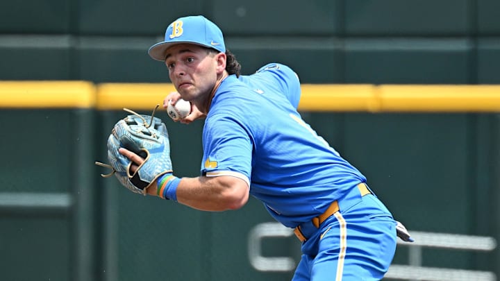 Jun 14, 2025; Omaha, Neb, USA;  UCLA Bruins shortstop Roch Cholowsky (1) completes a double play against the Murray State Racers during the second inning at Charles Schwab Field. Mandatory Credit: Steven Branscombe-Imagn Images
