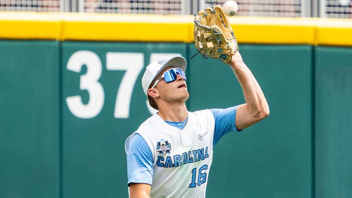 Jun 18, 2024; Omaha, NE, USA; North Carolina Tar Heels left fielder Casey Cook (16) makes a catch for an out against the Florida State Seminoles during the sixth inning at Charles Schwab Field Omaha. Mandatory Credit: Dylan Widger-Imagn Images Jun 18, 2024; Omaha, NE, USA; North Carolina Tar Heels left fielder Casey Cook (16) makes a catch for an out against the Florida State Seminoles during the sixth inning at Charles Schwab Field Omaha. Mandatory Credit: Dylan Widger-Imagn Images