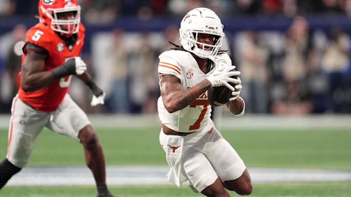 Dec 7, 2024; Atlanta, GA, USA; Texas Longhorns wide receiver Isaiah Bond (7) makes a catch past Georgia Bulldogs linebacker Raylen Wilson (5) during the first half in the 2024 SEC Championship game at Mercedes-Benz Stadium. Mandatory Credit: Dale Zanine-Imagn Images
