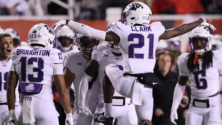 Oct 19, 2024; Salt Lake City, Utah, USA; TCU Horned Frogs safety Bud Clark (21) celebrates an interception against the Utah Utes with teammates during the fourth quarter at Rice-Eccles Stadium. Oct 19, 2024; Salt Lake City, Utah, USA; TCU Horned Frogs safety Bud Clark (21) celebrates an interception against the Utah Utes with teammates during the fourth quarter at Rice-Eccles Stadium.