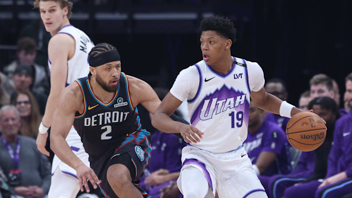 Dec 26, 2025; Salt Lake City, Utah, USA; Utah Jazz guard Ace Bailey (19) dribbles the ball as Detroit Pistons guard Cade Cunningham (2) defends during the first quarter at Delta Center. Mandatory Credit: Rob Gray-Imagn Images