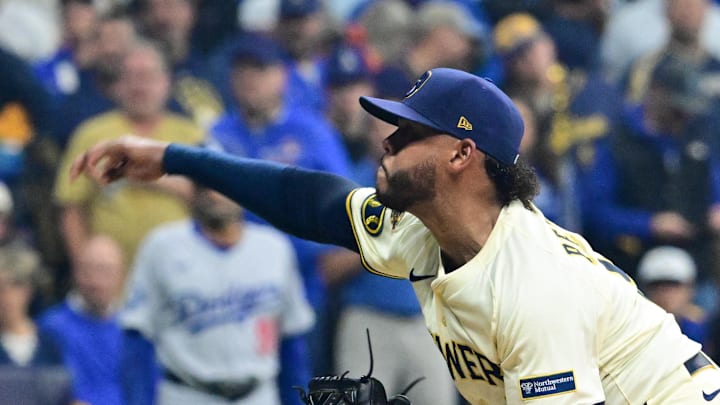 Oct 14, 2025; Milwaukee, Wisconsin, USA; Milwaukee Brewers pitcher Freddy Peralta (51) throws a pitch against the Los Angeles Dodgers in the first inning during game two of the NLCS round for the 2025 MLB playoffs at American Family Field. Mandatory Credit: Benny Sieu-Imagn Images