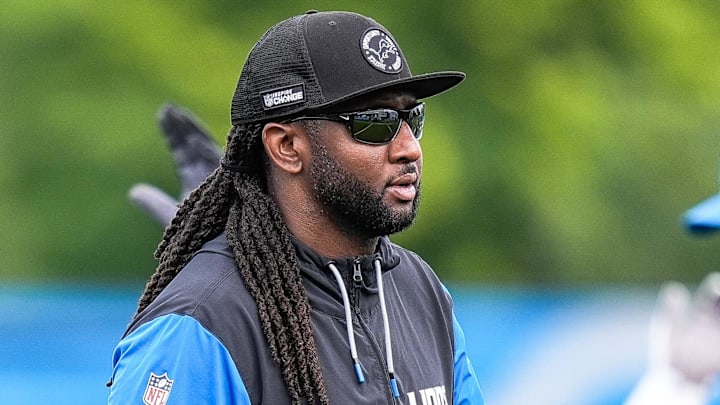 Detroit Lions defensive coordinator Kelvin Sheppard watches practice during training camp 
