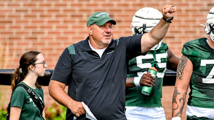 Michigan State's offensive line coach Jim Michalczik works with the team during the first day of football camp on Tuesday, July 30, 2024, in East Lansing.