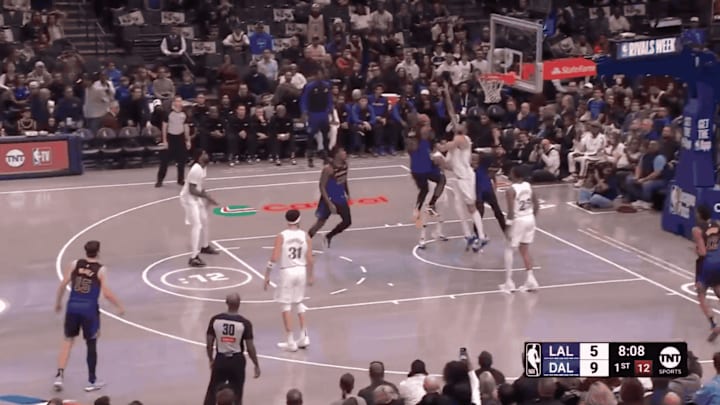 LeBron James throws down a dunk against the Dallas Mavericks.