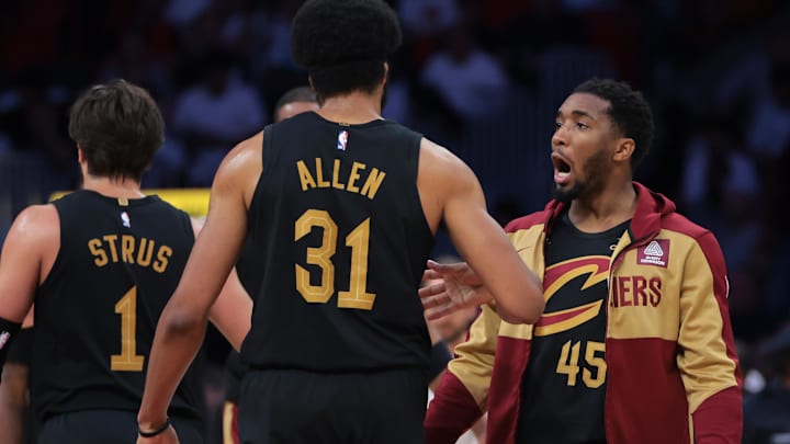 Apr 28, 2025; Miami, Florida, USA; Cleveland Cavaliers guard Donovan Mitchell (45) celebrates with center Jarrett Allen (31) against the Miami Heat in the second quarter during game four for the first round of the 2025 NBA Playoffs at Kaseya Center. Mandatory Credit: Sam Navarro-Imagn Images