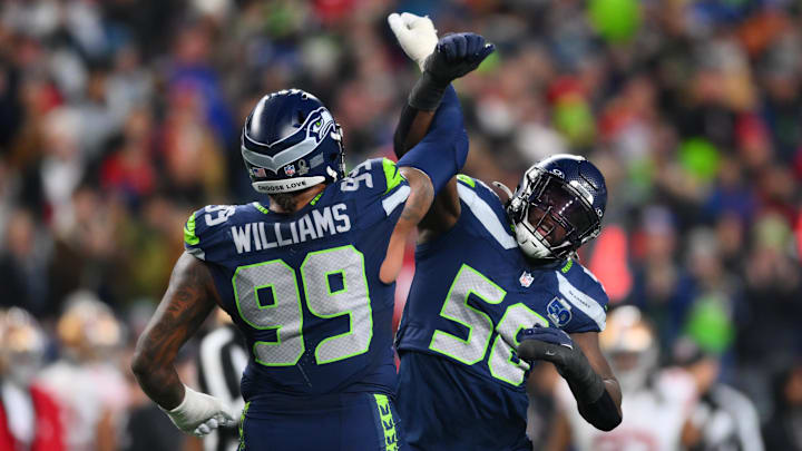 Seattle Seahawks DL Leonard Williams and LB Derick Hall react after the sack of San Francisco 49ers QB Brock Purdy.