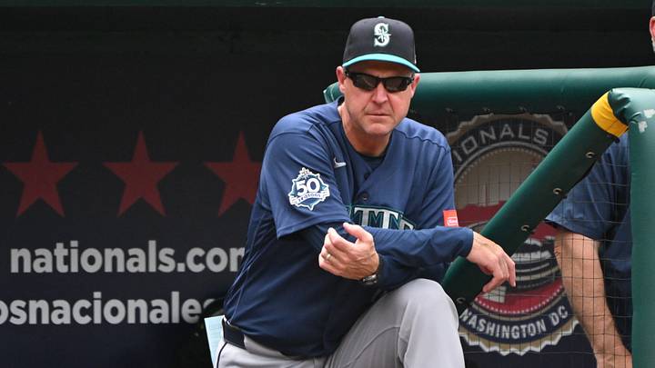 Jun 14, 2026; Washington, District of Columbia, USA; Seattle Mariners manager Dan Wilson (6) watches from the dugout against the Washington Nationals during the fifth inning at Nationals Park. Mandatory Credit: Rafael Suanes-Imagn Images Jun 14, 2026; Washington, District of Columbia, USA; Seattle Mariners manager Dan Wilson (6) watches from the dugout against the Washington Nationals during the fifth inning at Nationals Park. Mandatory Credit: Rafael Suanes-Imagn Images
