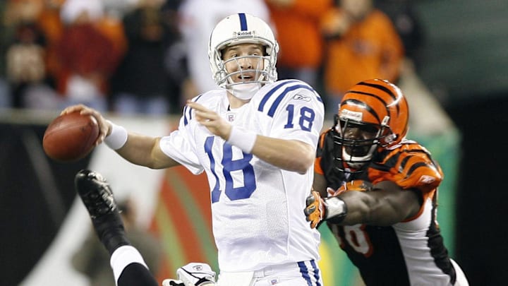 Nov  20, 2005; Cincinnati, OH, USA; Indianapolis Colts quarterback (18) Peyton Manning gets pressure in the pocket by Cincinnati Bengals defensive end (90) Justin Smith and (98) Bryan Robinson in the fourth quarter. Colts beat the Bengals 45-37. Mandatory Credit: Photo By Matthew Emmons- Imagn Images Copyright © 2005 Matthew Emmons