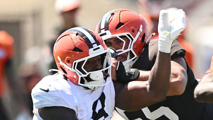 Cleveland Browns offensive tackle Spencer Fano (55) blocks defensive end Jared Verse (8)