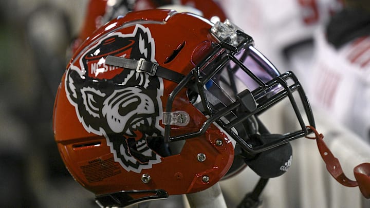 Nov 13, 2021; Winston-Salem, North Carolina, USA; A North Carolina State Wolfpack helmet seen on the sideline during the second half against the Wake Forest Demon Deacons at Truist Field. Mandatory Credit: William Howard-Imagn Images