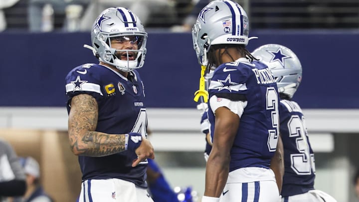 Dallas Cowboys quarterback Dak Prescott celebrates with wide receiver George Pickens after a touchdown.