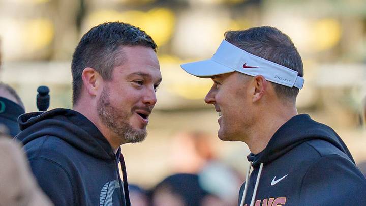 Oregon head coach Dan Lanning, left, and USC head coach Lincoln Riley shake hands before the game as the Oregon Ducks host the USC Trojans on Nov. 22, 2025, at Autzen Stadium in Eugene, Oregon. Oregon head coach Dan Lanning, left, and USC head coach Lincoln Riley shake hands before the game as the Oregon Ducks host the USC Trojans on Nov. 22, 2025, at Autzen Stadium in Eugene, Oregon.