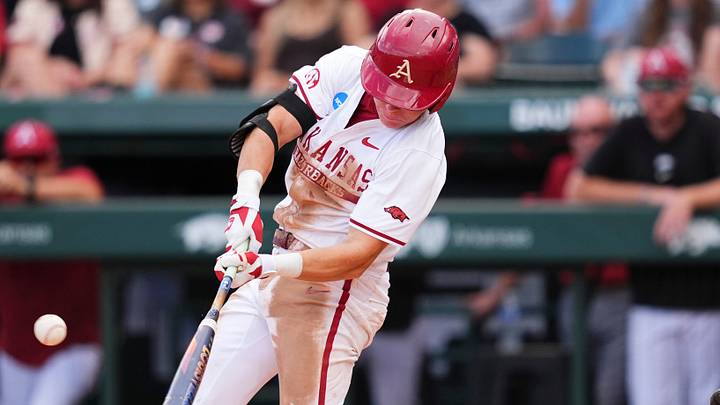 Arkansas' Charles Davalan (24) takes a swing during game one of the NCAA baseball tournament Fayetteville Super Regional between Tennessee and Arkansas held at Baum-Walker Stadium on Saturday, June 7, 2025.