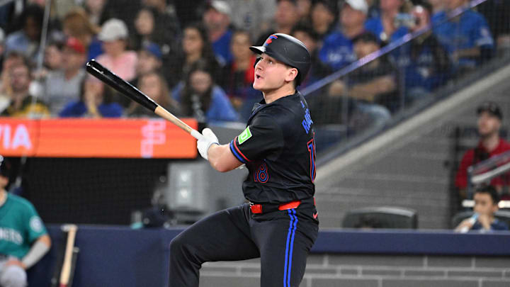 Apr 18, 2025; Toronto, Ontario, CAN;  Toronto Blue Jays left fielder Alan Roden (18) hits a RBI sacrifice fly against the Seattle Mariners in the second inning at Rogers Centre. 