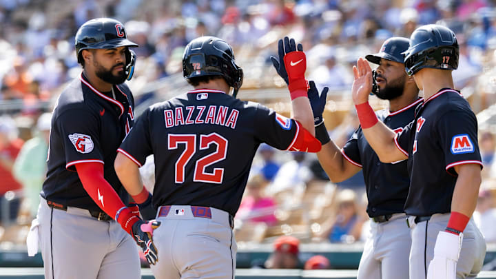Feb 24, 2026; Phoenix, Arizona, USA; Cleveland Guardians second baseman Travis Bazzana (72) celebrates with teammates after hitting a three run home run against the Los Angeles Dodgers during a spring training game at Camelback Ranch-Glendale. Mandatory Credit: Mark J. Rebilas-Imagn Images
