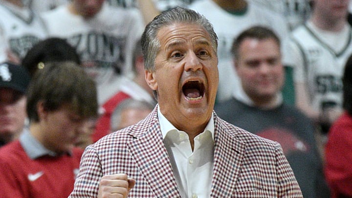 Arkansas Razorbacks coach John Calipari intentionally created a difficult schedule for his team this season. Here, he shouts in a play during the first half Saturday at Michigan State.