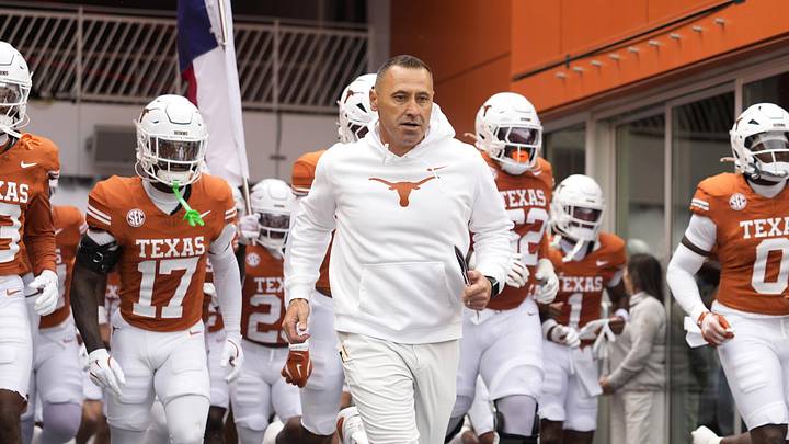 Texas Longhorns head coach Steve Sarkisian leads his team onto the field before a game against the Vanderbilt Commodores at Darrell K Royal-Texas Memorial Stadium.