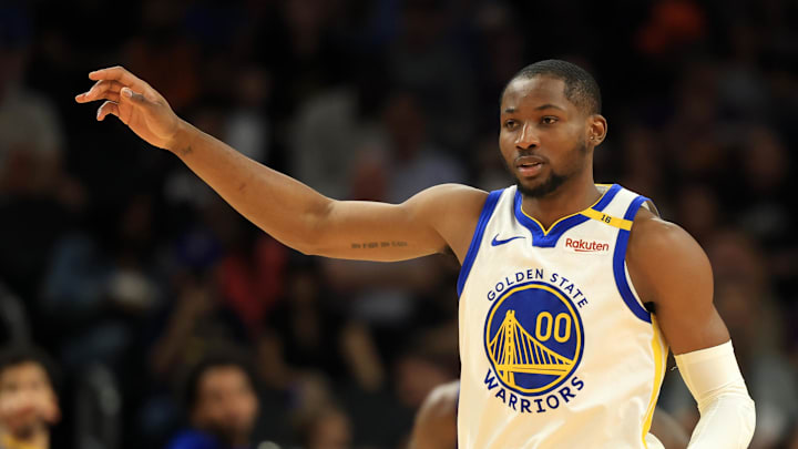 Apr 8, 2025; Phoenix, Arizona, USA; Golden State Warriors forward Jonathan Kuminga (00) against the Phoenix Suns at Footprint Center. Mandatory Credit: Mark J. Rebilas-Imagn Images