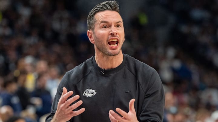Apr 27, 2025; Minneapolis, Minnesota, USA; Los Angeles Lakers head coach JJ Redick lobbies for possession due to a Minnesota Timberwolves player kicking the ball in the third quarter during game four of first round for the 2025 NBA Playoffs at Target Center. Mandatory Credit: Matt Blewett-Imagn Images