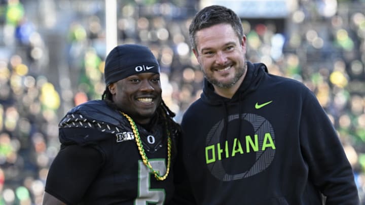 Oregon Ducks running back Noah Whittington poses for a photo with head coach Dan Lanning before the game against the Southern California Trojans at Autzen Stadium.