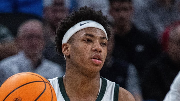 Mar 15, 2025; Indianapolis, IN, USA; Michigan State Spartans guard Jeremy Fears Jr. (1) passes the ball while  Wisconsin Badgers guard John Tonje (9) defends in the second half  at Gainbridge Fieldhouse.