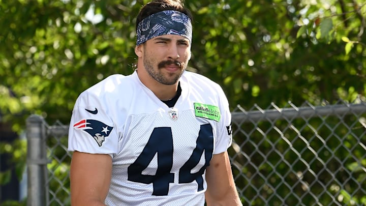 Former New England Patriots tight end Dalton Keene (44) walks to the practice field at the Patriots' training camp at Gillette Stadium. 