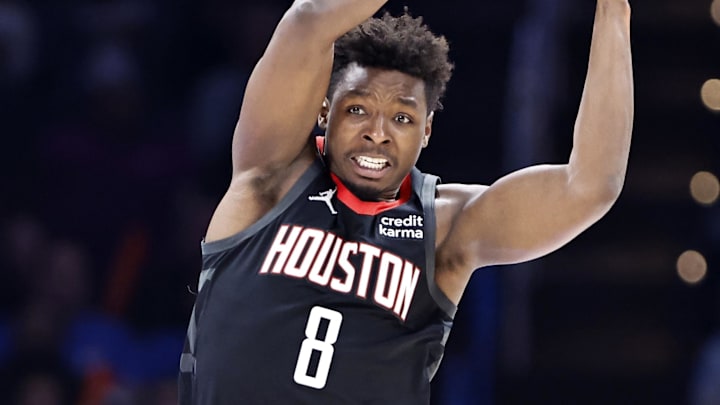 Houston Rockets forward Jae'Sean Tate (8) rebounds in front of Oklahoma City Thunder forward Jalen Williams (8) during the second quarter at Paycom Center.