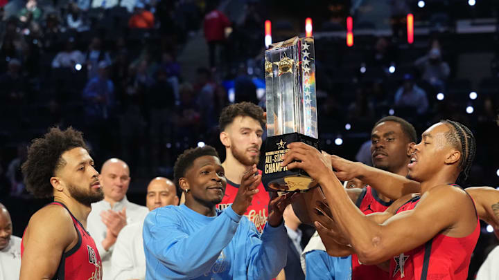 Feb 15, 2026; Inglewood, California, USA; Team USA Stars guard Cade Cunningham (2) of the Detroit Pistons, guard Anthony Edwards (5) of the Minnesota Timberwolves, center Chet Holmgren (7) of the Oklahoma City Thunder,  center Jalen Duren (0) of the Detroit Pistons, forward Scottie Barnes (4) of the Toronto Raptors and  forward Jalen Johnson (1) of the Atlanta Hawks, left to right, lift the trophy after defeating Team Stripes during the 75th NBA All Star Game at Intuit Dome. Mandatory Credit: