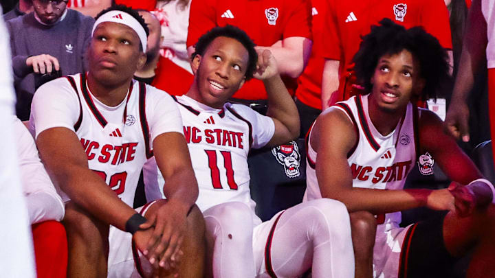 Feb 7, 2026; Raleigh, North Carolina, USA; NC State Wolfpack guard Quadir Copeland (11), forward Ven-Allen Lubin (22) and guard Jr. Paul McNeil (2) during the first half of the game against the Virginia Tech Hokies at Lenovo Center. Mandatory Credit: Jaylynn Nash-Imagn Images