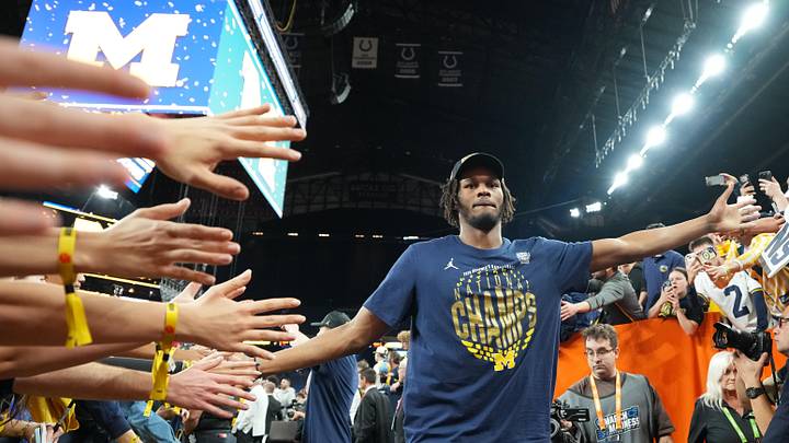 Apr 6, 2026; Indianapolis, IN, USA; Michigan Wolverines forward Morez Johnson Jr. (21) with fans after the National Championship of the Final Four of the men's 2026 NCAA Tournament at Lucas Oil Stadium. Mandatory Credit: Bob Donnan-Imagn Images