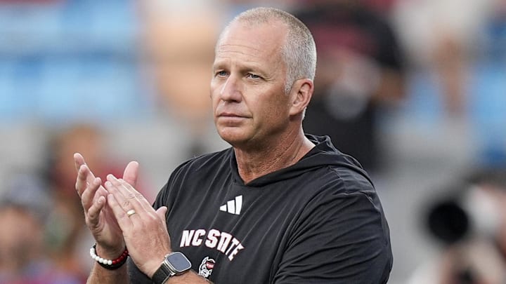 Sep 7, 2024; Charlotte, North Carolina, USA; North Carolina State Wolfpack head coach Dave Doeren during pregame activities against the Tennessee Volunteers at the Dukes Mayo Classic at Bank of America Stadium. Mandatory Credit: Jim Dedmon-Imagn Images