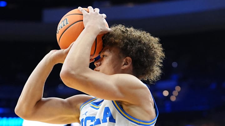 Mar 20, 2026; Philadelphia, PA, USA; UCLA Bruins guard Trent Perry (0) shoots the ball against the UCF Knights in the first half during a first round game of the men's 2026 NCAA Tournament at Xfinity Mobile Arena. Mandatory Credit: Kyle Ross-Imagn Images