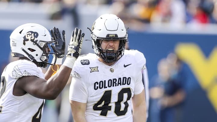 Nov 8, 2025; Morgantown, West Virginia, USA; Colorado Buffaloes linebacker Shaun Myers (40) celebrates a tackle for a loss during the second quarter against the West Virginia Mountaineers at Milan Puskar Stadium. Mandatory Credit: Ben Queen-Imagn Images