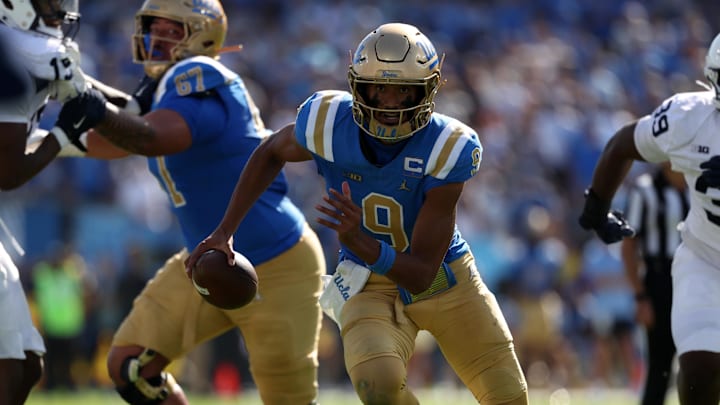 Oct 4, 2025; Pasadena, California, USA;  UCLA Bruins quarterback Nico Iamaleava (9) runs for a touchdown during the fourth quarter against the Penn State Nittany Lions at Rose Bowl. Mandatory Credit: Kiyoshi Mio-Imagn Images