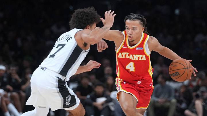 Oct 8, 2026; San Antonio, Texas, USA; Atlanta Hawks guard Kingston Flemings (4) looks to pass the ball while defended by San Antonio Spurs guard Ja'Kobi Gillespie (17) during the second half at Frost Bank Center. Oct 8, 2026; San Antonio, Texas, USA; Atlanta Hawks guard Kingston Flemings (4) looks to pass the ball while defended by San Antonio Spurs guard Ja'Kobi Gillespie (17) during the second half at Frost Bank Center.