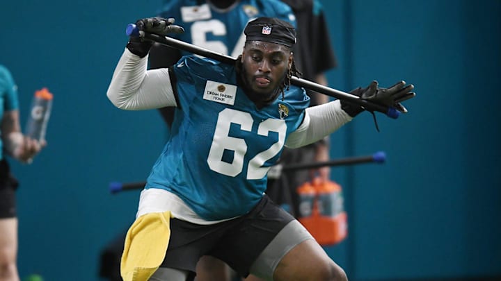 Jacksonville Jaguars offensive tackle Javon Foster (62) works out during Friday's rookie minicamp. The Jacksonville Jaguars held their first day of rookie minicamp inside the covered field at the Jaguars performance facility in Jacksonville, Florida Friday, May 10, 2024.