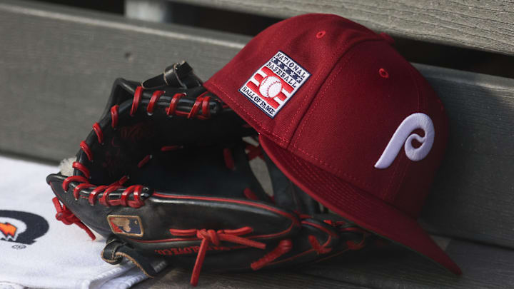 Jul 25, 2025; Bronx, New York, USA; A detailed view of a Hall of Fame patch on a Philadelphia Phillies hat resting in the dugout during the second inning against the New York Yankees at Yankee Stadium. 