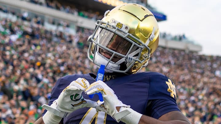 Nov 22, 2025; South Bend, Indiana, USA; Notre Dame Fighting Irish running back Jeremiyah Love (4) celebrates scoring against the Syracuse Orange during the first half at Notre Dame Stadium. Mandatory Credit: Michael Caterina-Imagn Images