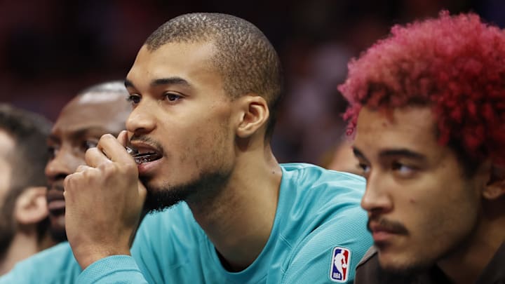 Jan 31, 2026; Charlotte, North Carolina, USA; San Antonio Spurs forward Victor Wembanyama (1) watches from the bench during second half action against the Charlotte Hornets at Spectrum Center. Jan 31, 2026; Charlotte, North Carolina, USA; San Antonio Spurs forward Victor Wembanyama (1) watches from the bench during second half action against the Charlotte Hornets at Spectrum Center.