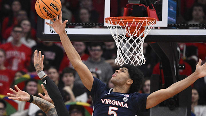 Jan 18, 2025; Louisville, Kentucky, USA; Virginia Cavaliers forward Jacob Cofie (5) foul Louisville Cardinals guard Terrence Edwards Jr. (5) while blocking his shot during the first half at KFC Yum! Center. Mandatory Credit: Jamie Rhodes-Imagn Images Jan 18, 2025; Louisville, Kentucky, USA; Virginia Cavaliers forward Jacob Cofie (5) foul Louisville Cardinals guard Terrence Edwards Jr. (5) while blocking his shot during the first half at KFC Yum! Center. Mandatory Credit: Jamie Rhodes-Imagn Images