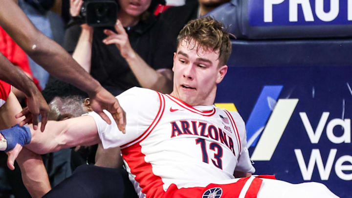 Jan 21, 2026; Tucson, Arizona, USA; Arizona Wildcats center Motiejus Krivas (13) reaches for the ball during the first half of the game against the Cincinnati Bearcats at McKale Memorial Center. Mandatory Credit: Aryanna Frank-Imagn Images