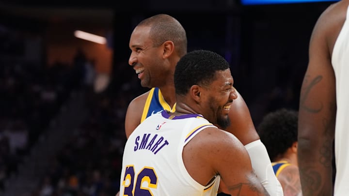 Feb 28, 2026; San Francisco, California, USA;  Los Angeles Lakers guard Marcus Smart (36) laughs with Golden State Warriors center-forward Al Horford (20) in the third quarter at Chase Center. Mandatory Credit: David Gonzales-Imagn Images