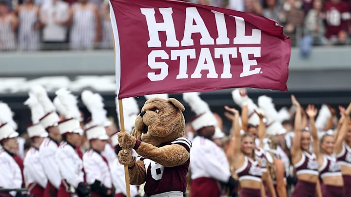 Mississippi State Bulldogs mascot Bully waves a Hail State flag prior to the game against the Texas Longhorns at Davis Wade Stadium at Scott Field.